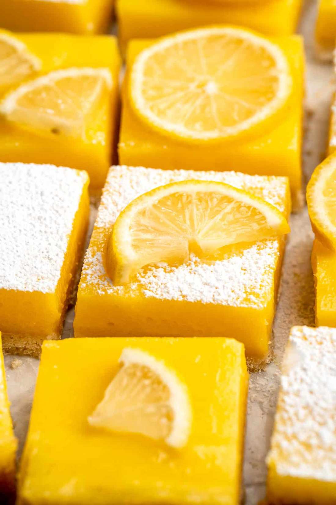 Classic lemon bars with buttery shortbread base, tangy lemon curd, and powdered sugar topping