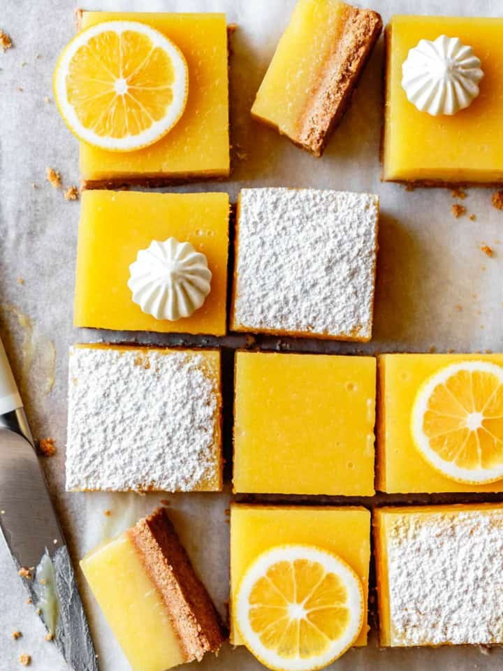 Golden gluten‑free shortbread, bright lemon curd, light powdered sugar topping