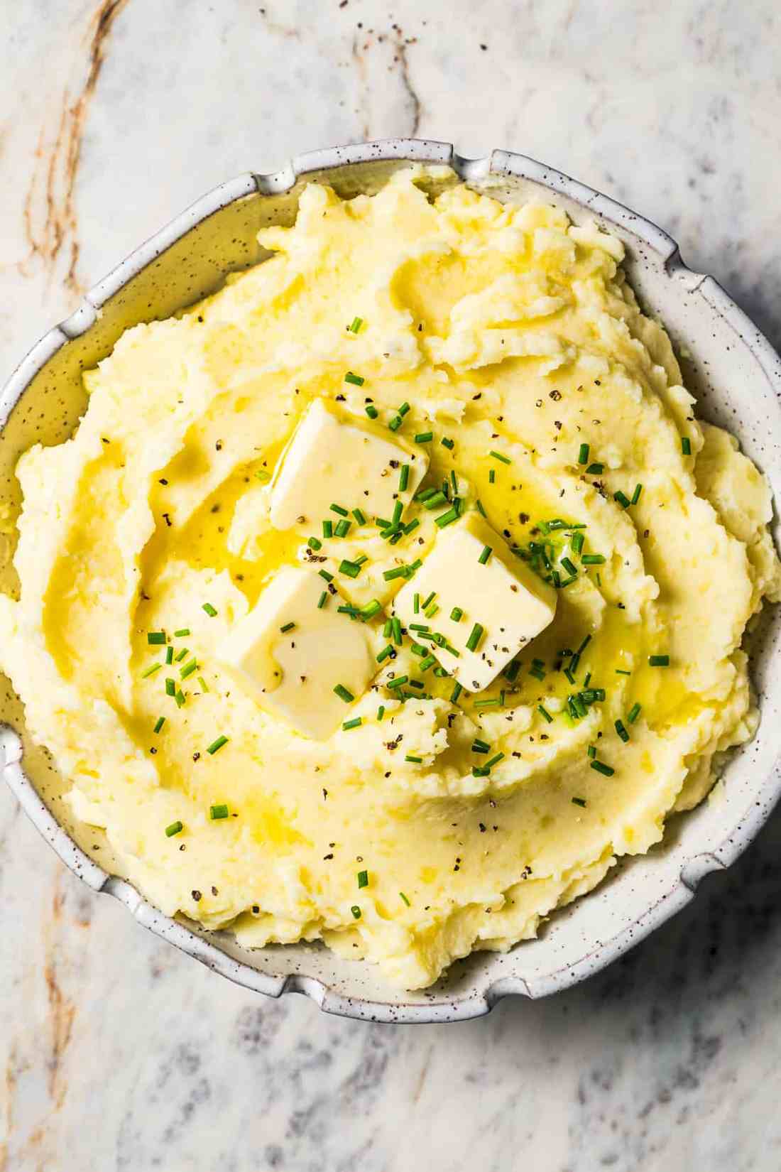 Roasted garlic buttermilk mashed potatoes whipped with sweet melted butter and fresh chopped parsley