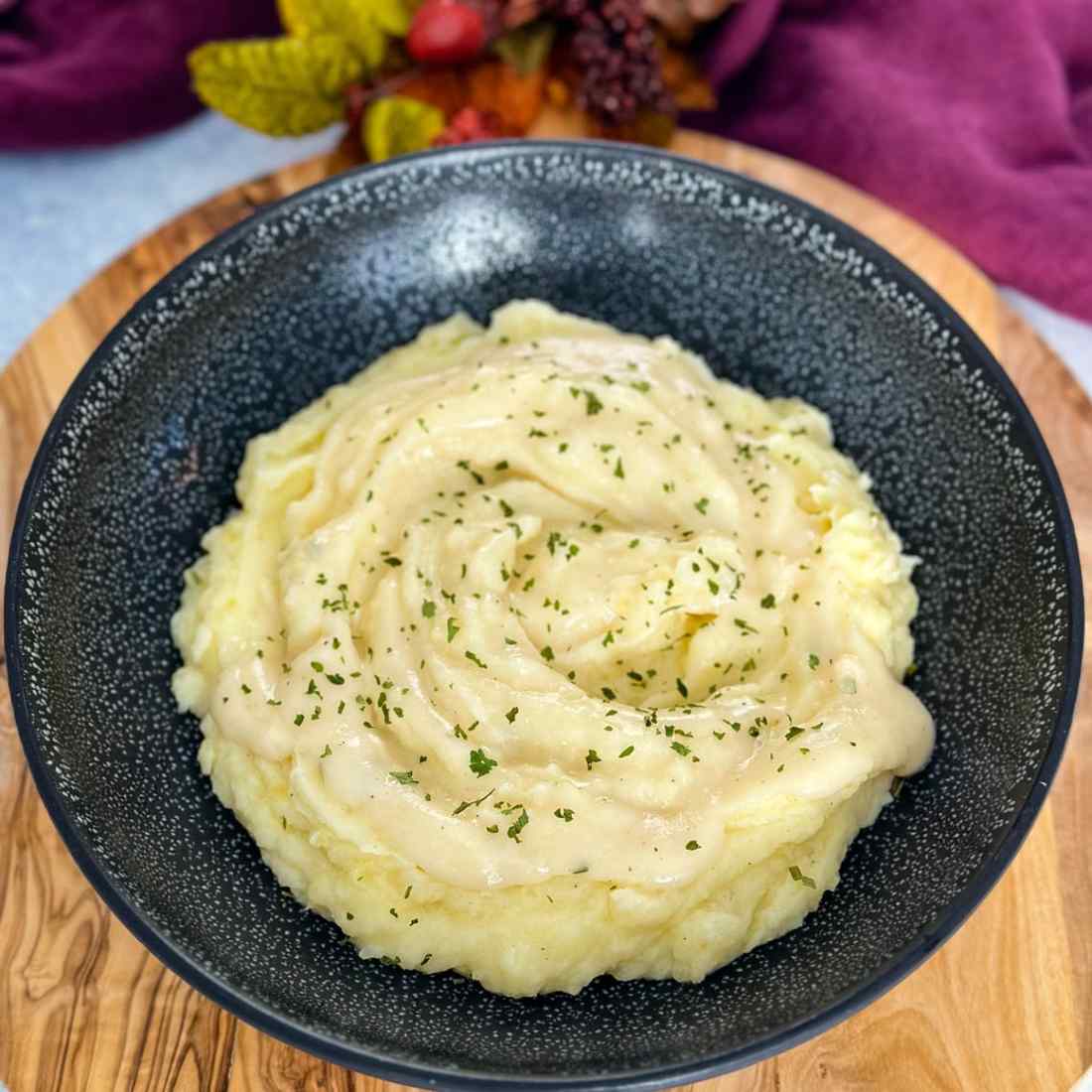 Fluffy buttermilk mashed potatoes blended with zesty prepared horseradish and creamy butter in bowl