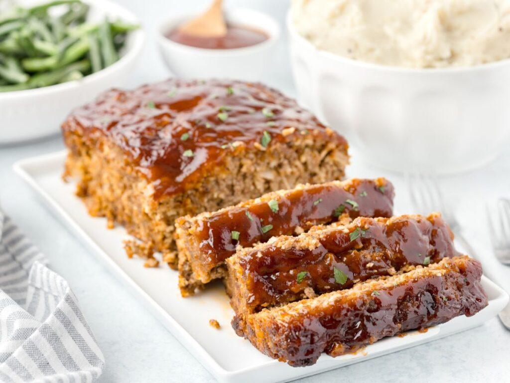 Smoky chipotle BBQ meatloaf with a glossy glaze, spicy undertones, and tender, juicy meat