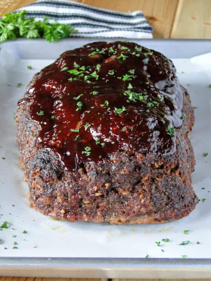 Hearty BBQ meatloaf with rich tomato glaze, golden crust, and succulent interior