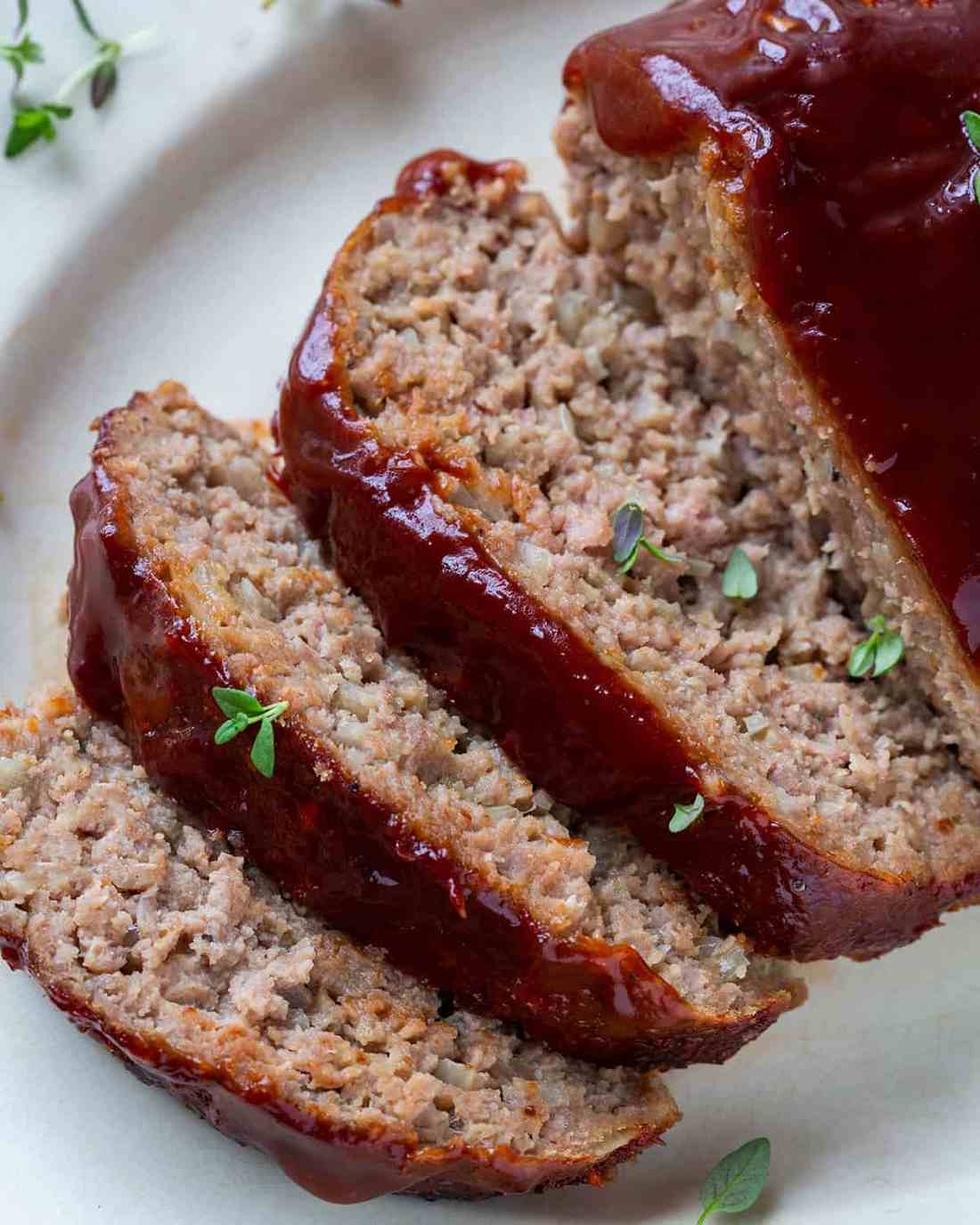 Juicy turkey meatloaf topped with a caramelized sweet onion glaze, golden crust, and a hint of thyme