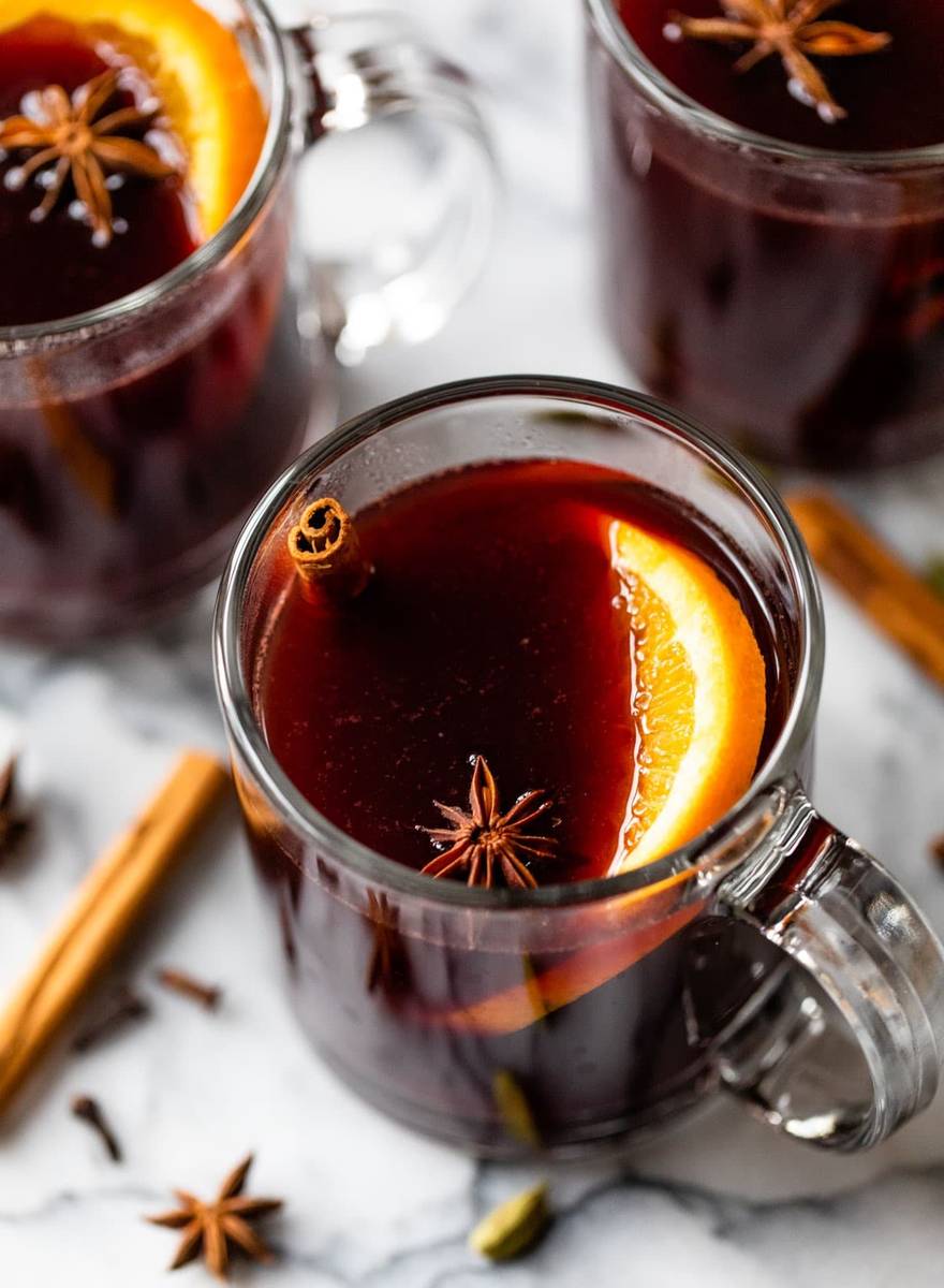 Slow cooker spiced red wine packed with orange, lemon, and lime slices with cinnamon sticks