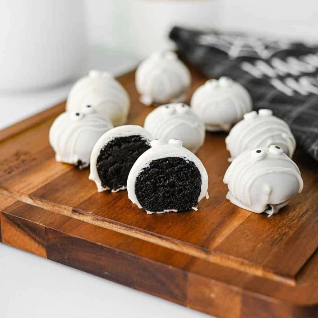 Oreo truffle balls coated in smooth white chocolate and crisscrossed with white mummy drizzle and candy eyes.