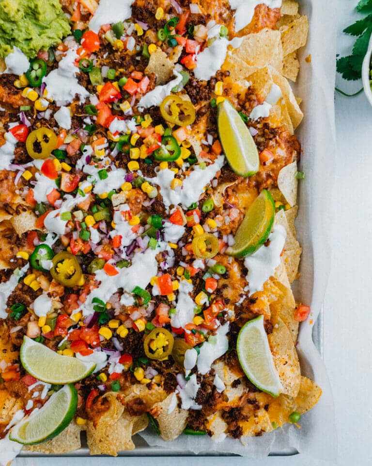 38 Cheesy Loaded Nacho Recipes for Game Day