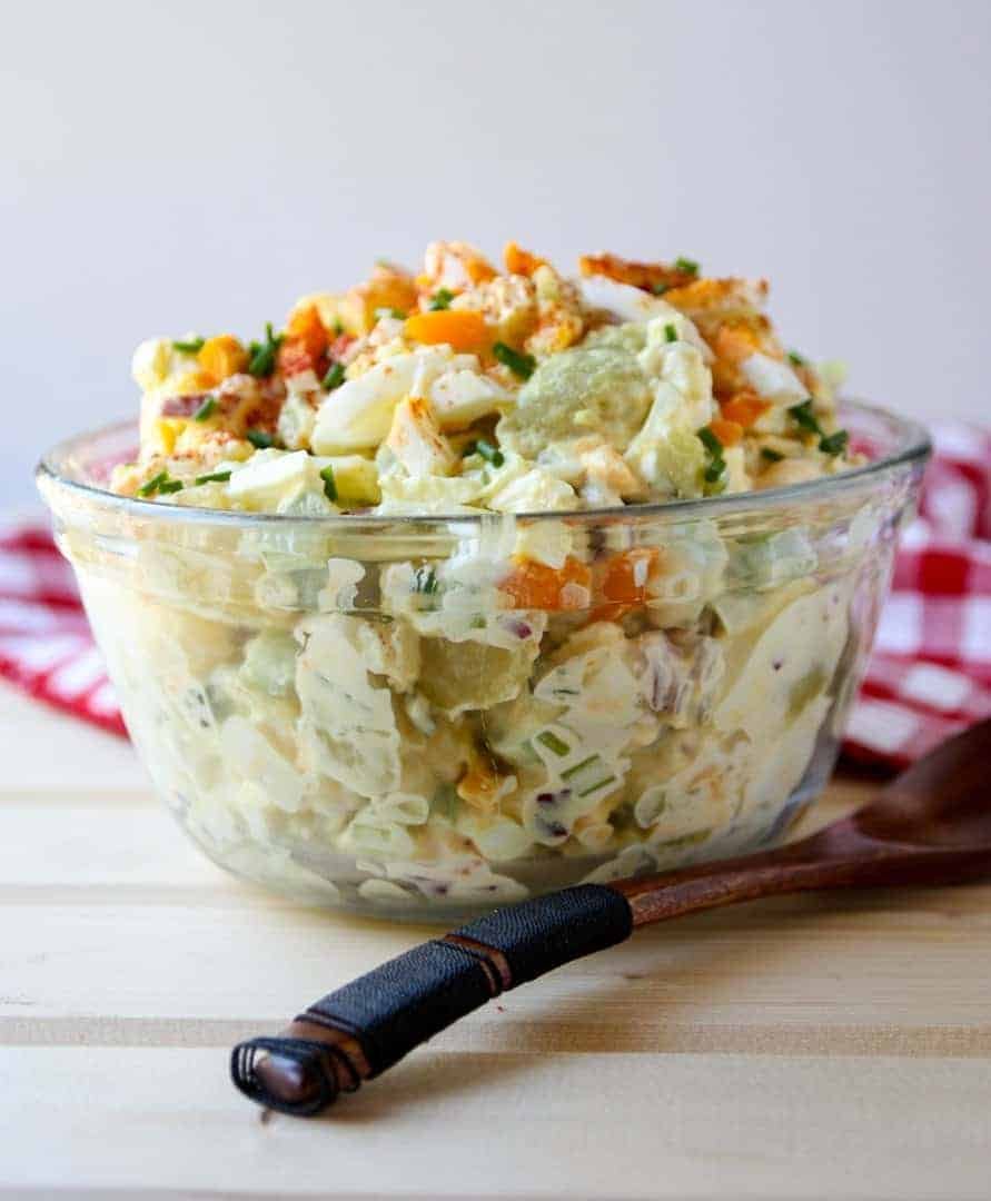 Classic creamy potato salad featuring tender potatoes, crunchy celery, and a luscious herb-infused dressing