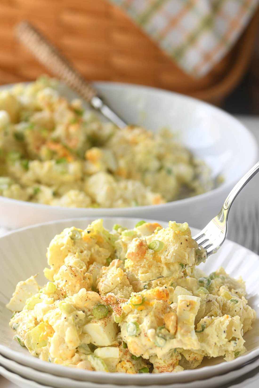 Classic creamy potato salad with tender potatoes, velvety dressing, fresh herbs, crunchy celery