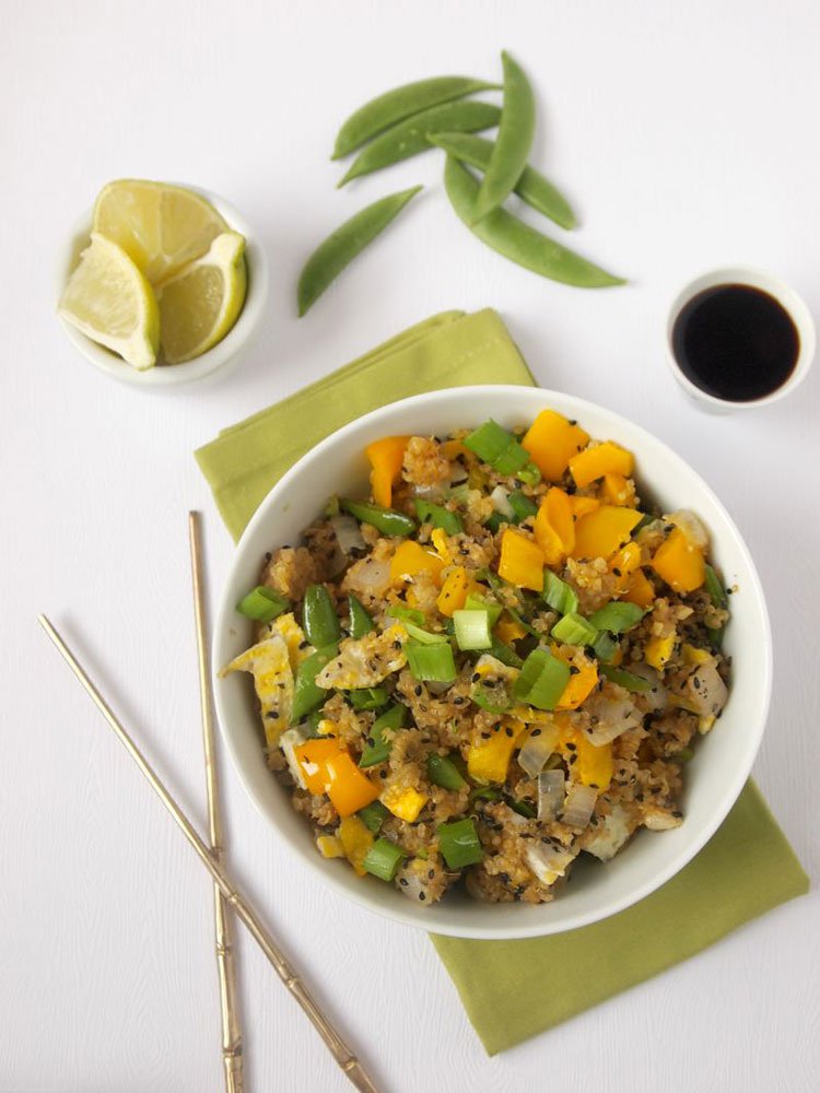 Herb‑infused quinoa fried rice with fresh basil, parsley, and colorful veggies