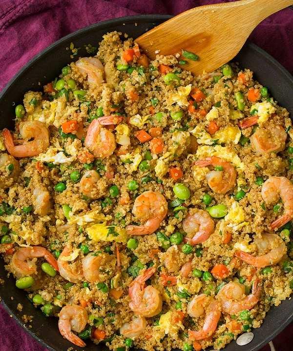 Mediterranean quinoa fried rice with colorful veggies, olives, and soy glaze