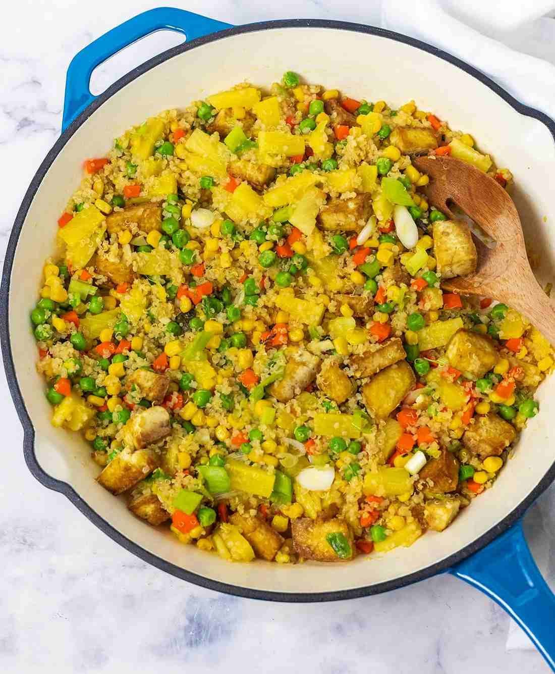 Pineapple coconut quinoa fried rice with fluffy grains, pineapple, and soy glaze