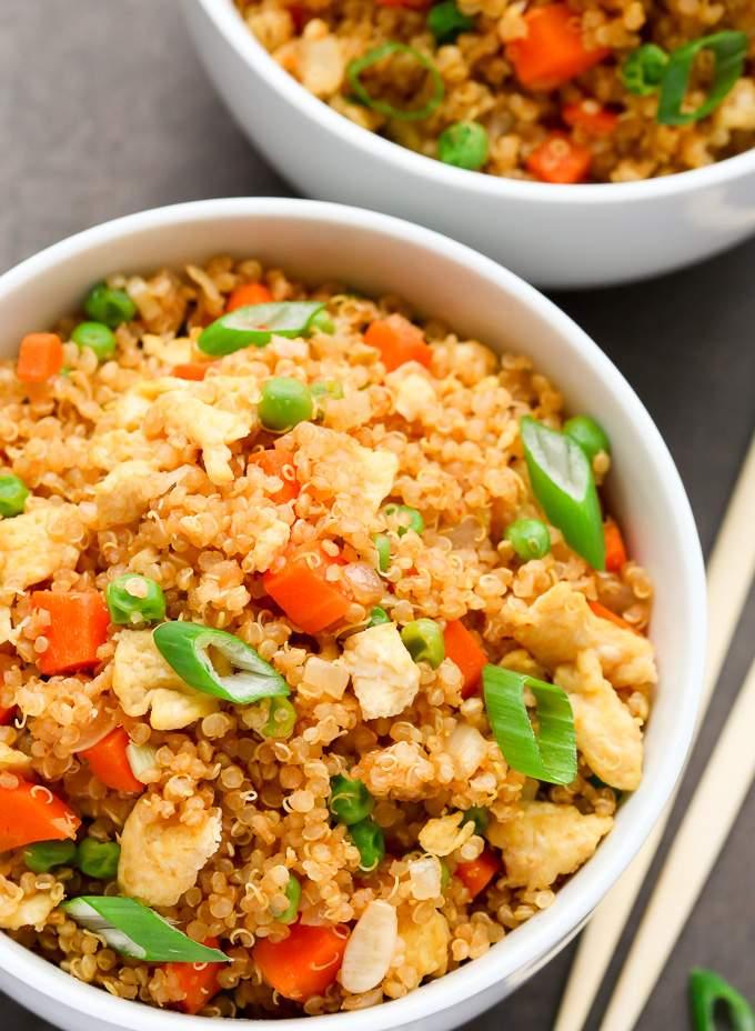 Rainbow quinoa fried rice with bell peppers, corn, and a glossy soy glaze.