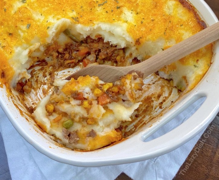 Comforting shepherd's pie, garlic‑parmesan mashed crown, savory beef filling, bubbling cheese, warm casserole dish