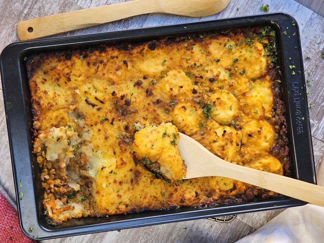 Golden mashed potato crowned homestyle shepherd's pie with savory beef filling, bubbling cheese, warm casserole