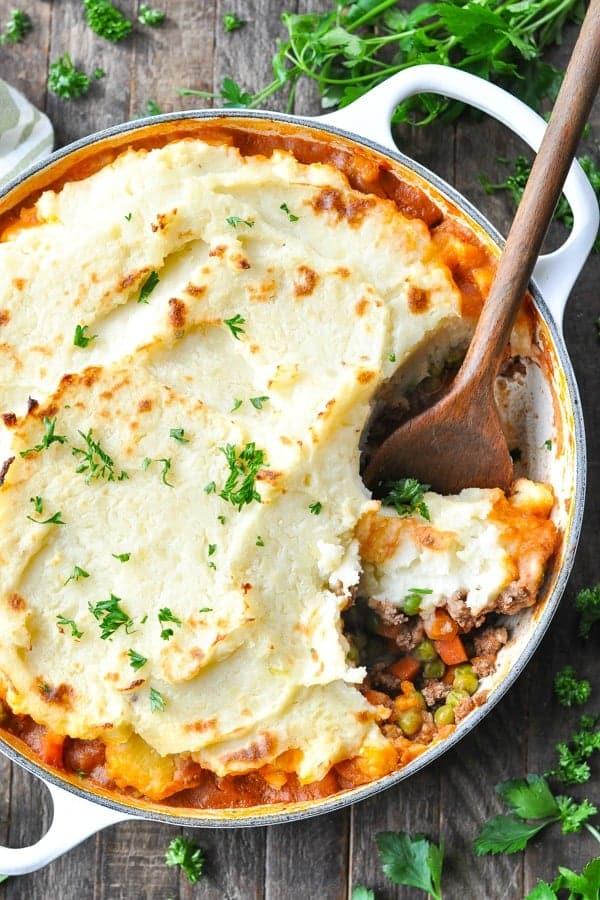 Golden mashed potato crowned ground beef cottage pie with savory filling, bubbling cheese, warm casserole