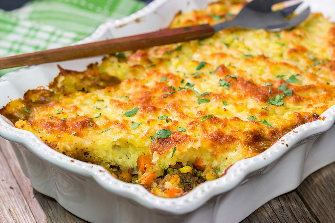 Golden mashed potato crowned homestyle shepherd's pie with savory beef filling, bubbling cheese, warm casserole
