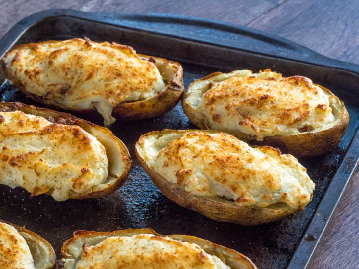 Golden mashed potato‑topped homestyle shepherd’s pie with savory beef filling, bubbling cheese, warm casserole