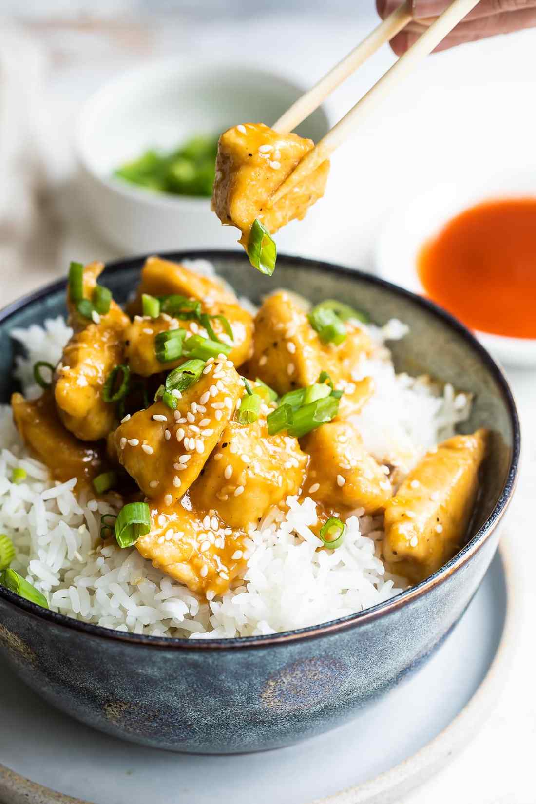 Chicken glazed with a honey‑soy orange sauce, topped with sliced orange and scallions