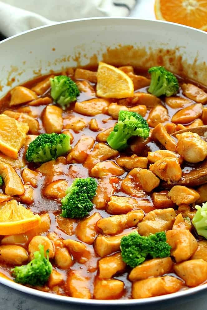 Chicken glazed in orange sauce served with a mix of stir‑fried broccoli, carrots, and bell peppers