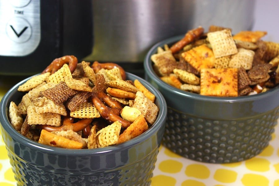 Classic Chex party mix with crunchy pretzels, peanuts, butter, and savory seasoning