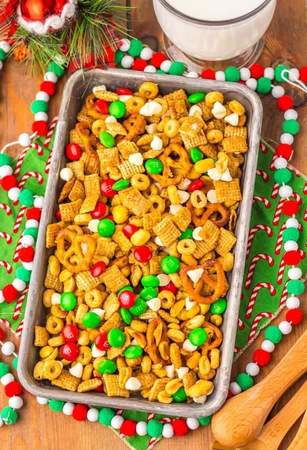 Festive Chex mix with peppermint bark, pretzel sticks, and white chocolate drizzle