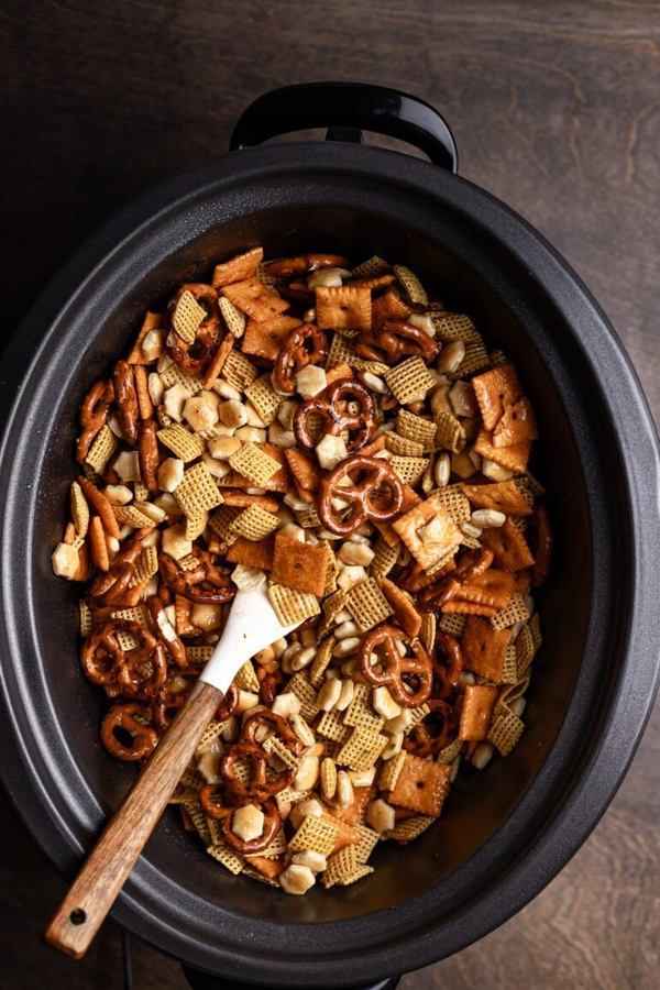 Ranch seasoned chex mix featuring crunchy Chex cereal, pretzels, nuts, creamy ranch flavor, and a golden coating