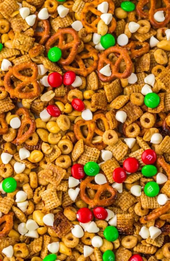 Christmas chex mix with crunchy Chex cereal, pretzels, nuts, festive seasoning, and a glistening holiday glaze
