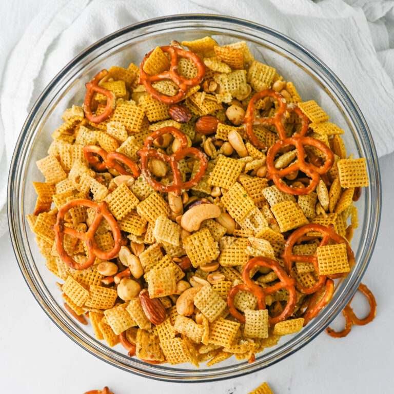 Easy homemade chex mix with crunchy Chex cereal, pretzels, nuts, buttery coating, and savory seasoning
