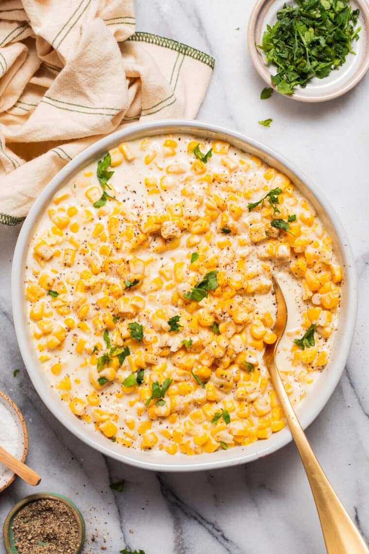 Classic slow‑cooker creamed corn with garlic, sweet corn and buttery sauce, comforting crockpot side