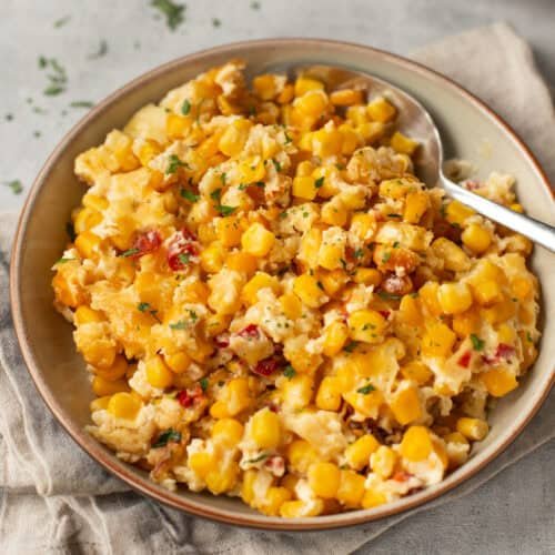 Cheesy cheddar creamed corn, slow cooker side with creamy sauce, golden cheese swirl