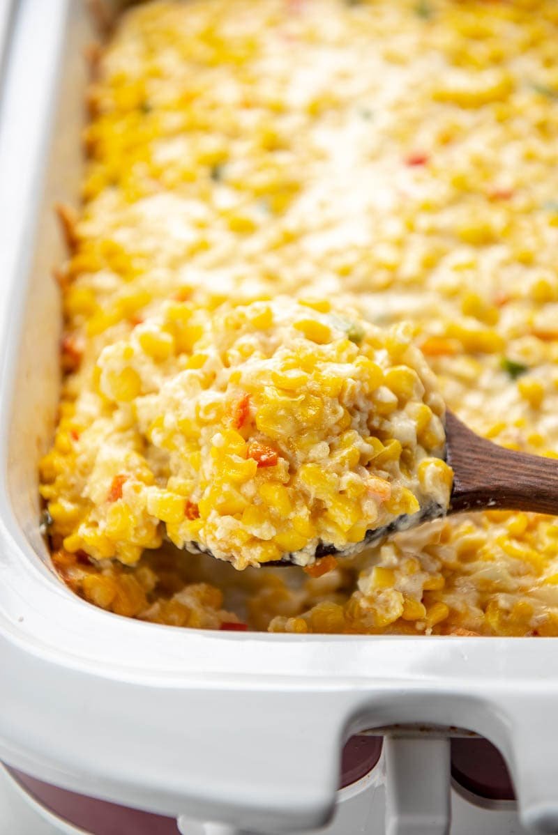 Cheesy cheddar creamed corn, slow cooker side with creamy sauce, golden cheese swirl