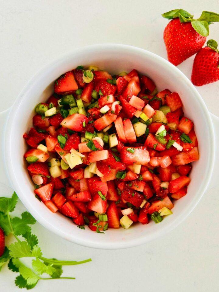 Classic fresh strawberry salsa with strawberries, lime, cilantro, and a splash of honey