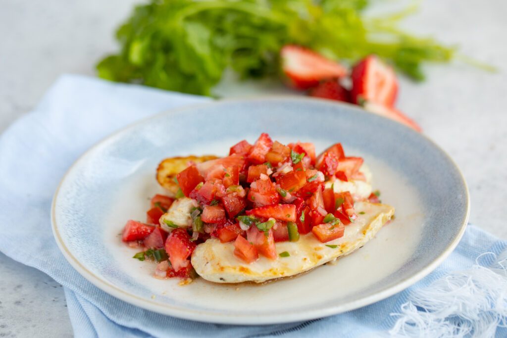 Fresh strawberry salsa atop juicy grilled chicken, bright lime, cilantro, and a hint of jalapeño