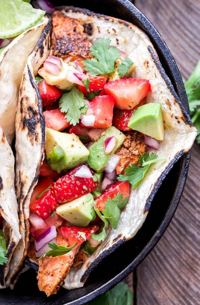 Creamy avocado blended with strawberry salsa, lime, cilantro, and a hint of garlic