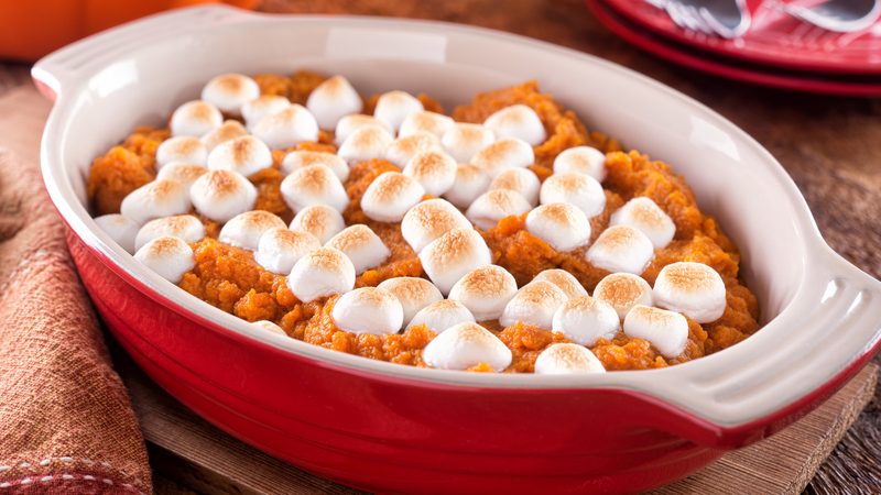 Classic sweet potato casserole flavored with dark molasses and warm autumn spices in baking pan