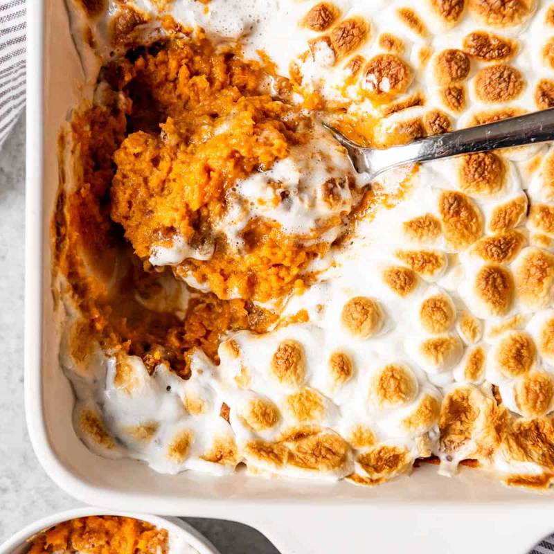 Southern classic sweet potato casserole bubbling with buttery brown sugar, cinnamon, and pecan streusel.