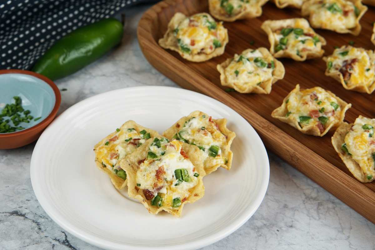 Crispy wonton cups filled with creamy jalapeño popper mixture and topped with bacon bits