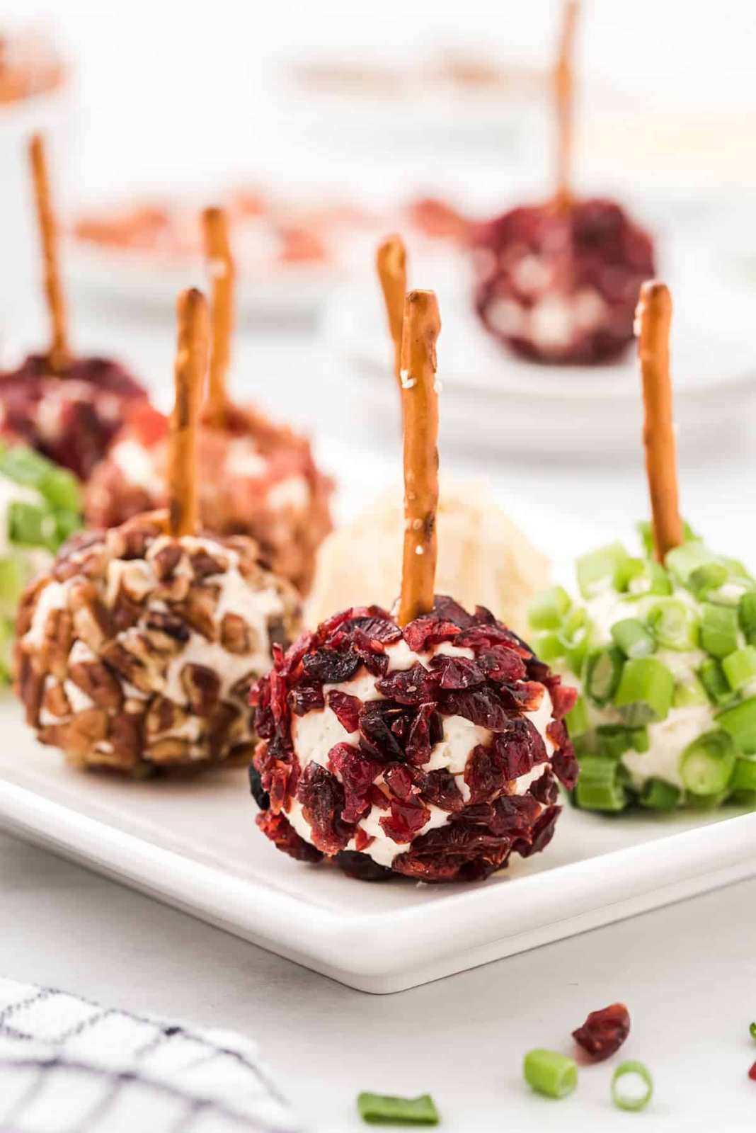 Soft cheese balls coated in pretzel crumbs and baked to a golden finish